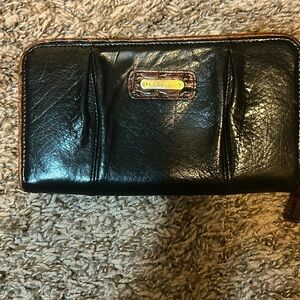 Black and brown Brahmin women long zipper wallet.